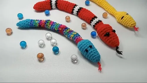 Crochet amigurumi snake fidget with marble rattle — photo 2
