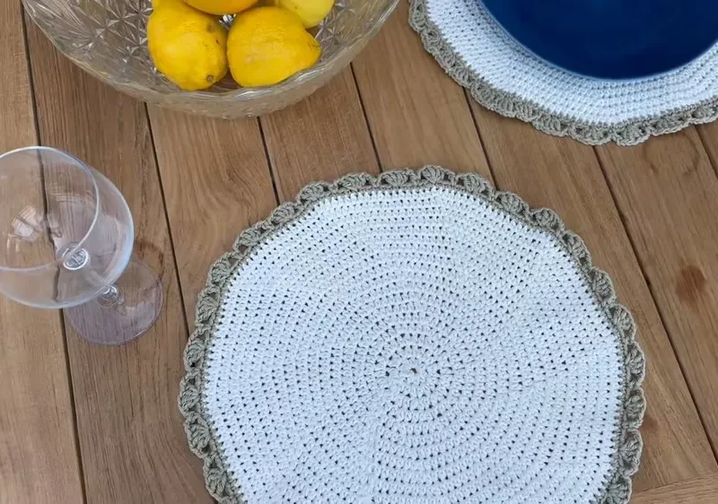 Crochet placemat pattern with a half double crochet base and shell border