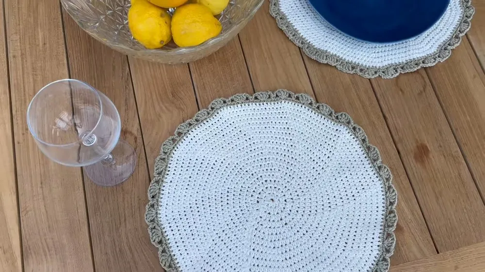 Crochet placemat pattern with a half double crochet base and shell border